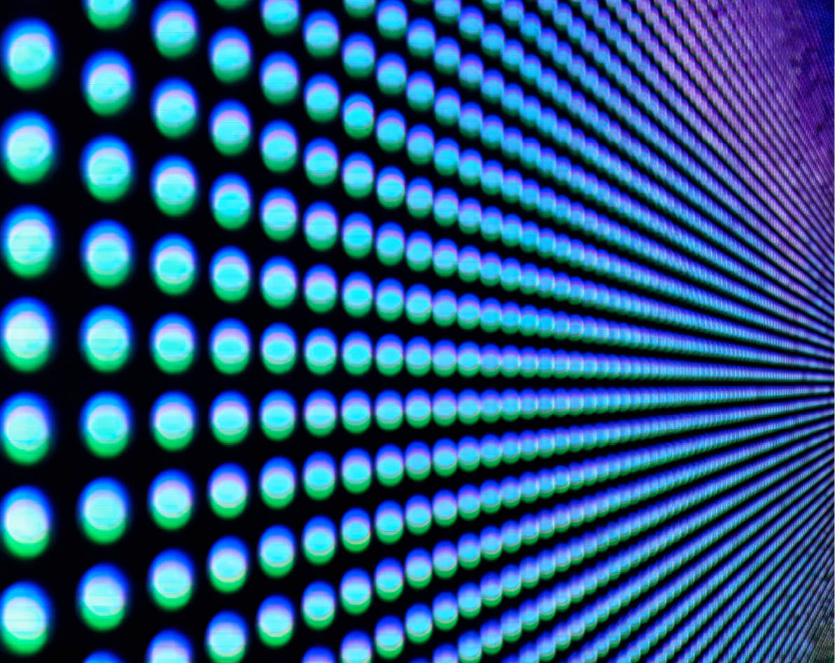 Background of colorful luminous circles, close-up of a led screen.