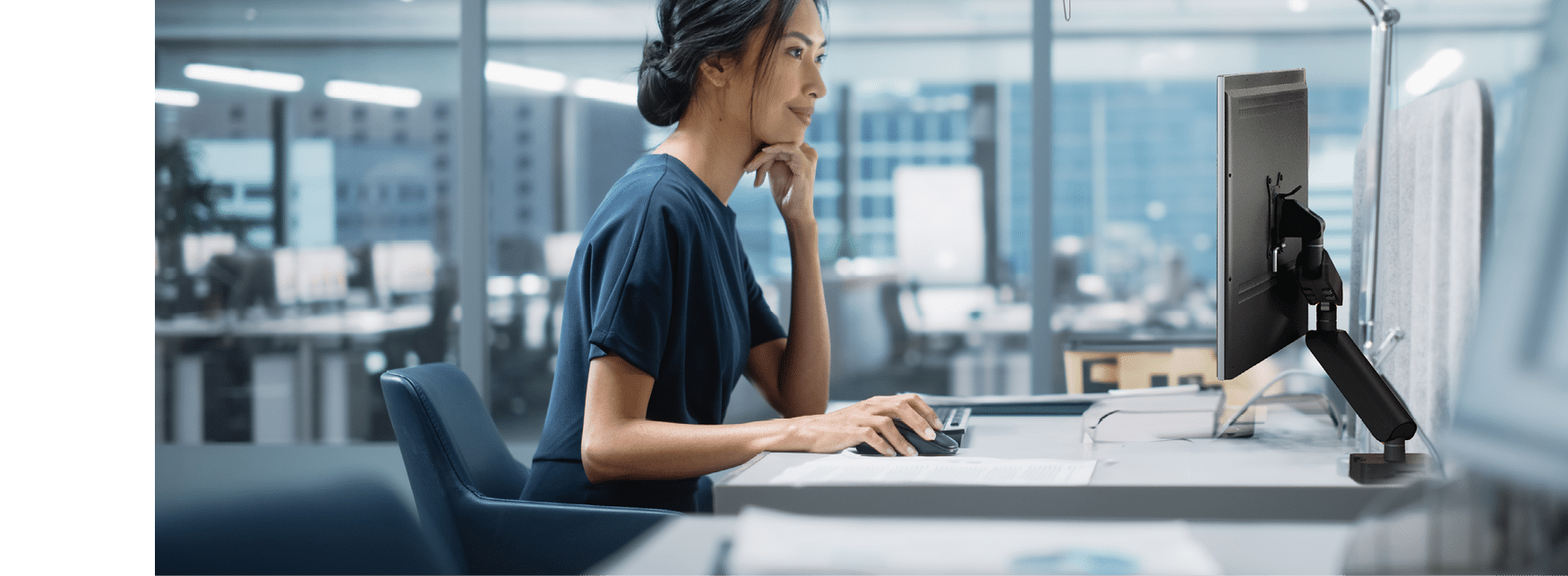 In Big Diverse Corporate Office: Portrait of Beautiful Asian Manager Using Desktop Computer, Businesswoman Managing Company Operations, Analysing Statistics, Commerce Data, Marketing Plans.